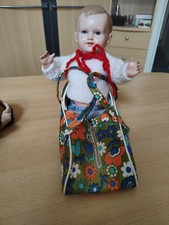 Puppe mit Tragetasche