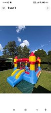 Hüpfburg Aufblasbar Spielburg Outdoor Bouncer mit Rutsche Bunt