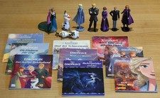 8 Figuren und 9 Bücher