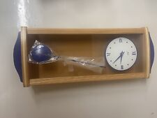 wanduhr mit pendel modern