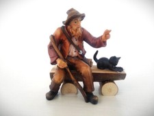 Hirte sitzend mit Katze auf