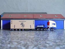 Herpa 1:87 - MAN TGX E6 XLX 7-achs Semitiefladersattelzug + Großkiste - "Anker"