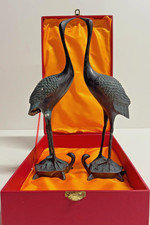 Antike bronzene Kraniche auf