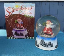 Weihnachtsmann Schneekugel mit Spieluhr Neuwertig 