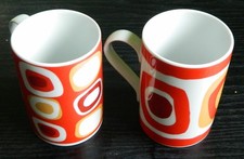 2 Tassen Porzellan Original Bohemia verschiedene Motive weiß/orange DxH 7x10 cm