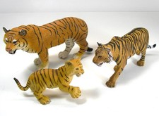 Lot tiger figures by - of,
