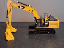 CCM CAT 336E L Bagger 1:24 mit