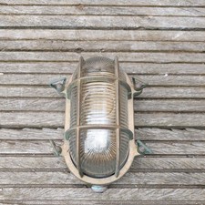  Schiffslampe oval Altmessing patiniert