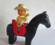 Lego Duplo, Cowboy auf schwarzem Pferd mit rotem Sattel, Reiter
