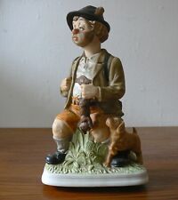 MELODY IN MOTION PENNER WILLIE ALS JÄGER BUISQUIT PORZELLAN FIGUR SPIELUHR