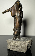 Bronzefigur – Maskierte