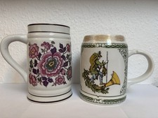 2 Bierkrüge 0,5 l Porzellan mit Blumenmotiv und Jagdmotiv