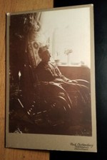 old woman sitting in rocking