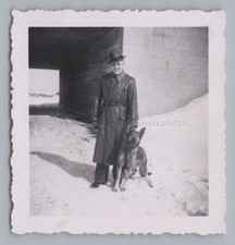 Man with Hat Leather Coat Dog
