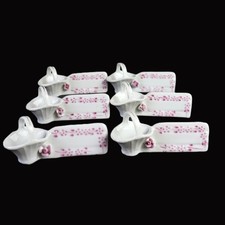 Porzellan Set mit 6 Messerbänkchen aus Porzellan mit Korb und Rosenmotiv, France