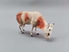 braun gefleckte Kuh Figur