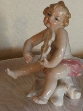 Porzellan-Figur Kind mit