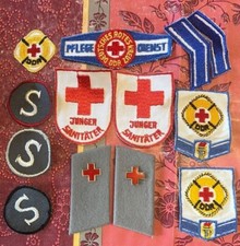 Konvolut Stoffabzeichen DDR Rotes Kreuz NVA Kragenspiegel