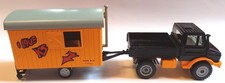 Siku 2533 Unimog mit Bauwagen orange grau schwarz "Schule ist in" 1:55 sehr gut