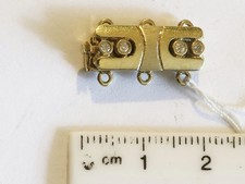 Hübsche dreireihige Schließe in  echt Gold 14 karat mit Diamanten