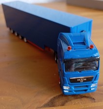 AWM MAN TGX mit Jumbo Gardinenauflieger, 1:87