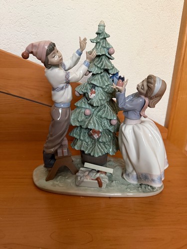 Lladro trimming the - the, tree"