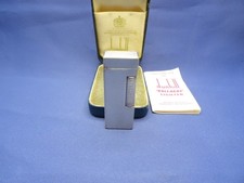 Dunhill Rollagaz Feuerzeug in Silber Design in Original Box  und ist gasdicht