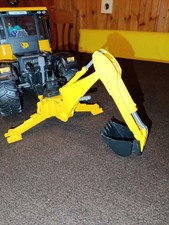 Heckbagger mit Greifer von