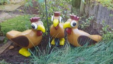 3D Tier sitzendes buntes Huhn
