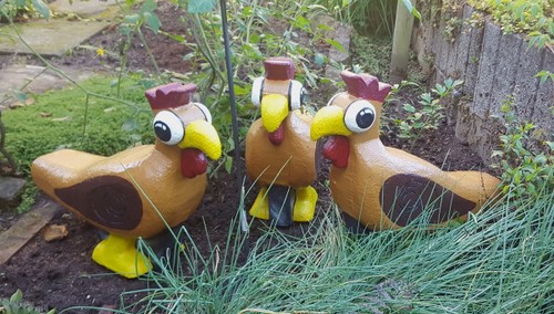 Tier sitzendes buntes huhn - sitzendes,