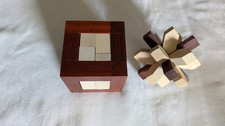 2 Holzpuzzle Geduldsspiele "Würfel im Würfel" & "Schneeflocke"