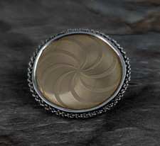 Brosche gold Spirale