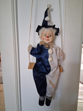 Marionette auf Schaukel  Clown