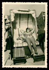 Woman showing armpits in beach