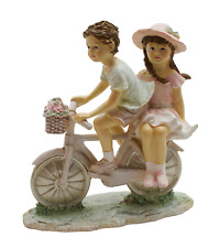 Deko Kinderpaar auf Fahrrad
