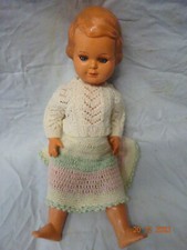 Alte Puppe, Logo großes S, und ein Storch mit Kind auf dem Rücken, mit Nr 56