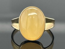 RING GR.18,5 (CA.58) AUS 333/- GELBGOLD MIT HONEY JADE SOGNI D'ORO SCHMUCKJAGD