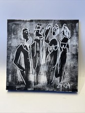 People in black with paper