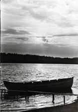 Ak Ruderboot im Sonnenuntergang