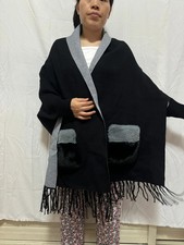 Strickponcho Strickumhang