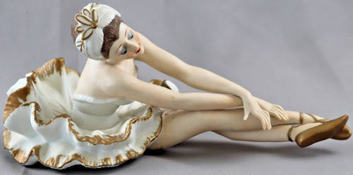 Porzellanfigur sitzende