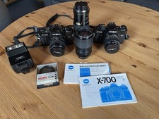 2 Minolta X-700 Spiegelreflexkameras + 4 Objektive + Minolta Blitz Auto 280