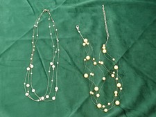 2 Perlenketten, schwebende Perlen