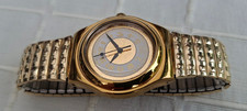 goldene Swatch Uhr mit Flexarmband, Superzustand
