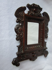 alter Spiegel mit Facette im geschnitztem reich verziertem Holzrahmen dekorativ