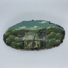 Wandbild auf einer Baumscheibe