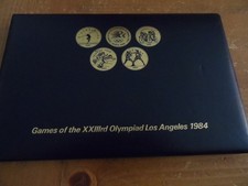 Olympia Los Angeles 1984 - 24 dekorative Münzen mit verschiedenen Sport-Motiven