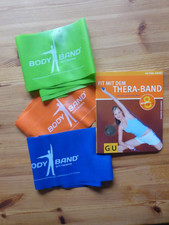 Thera Band  -  Buch und 3 Bänder in unterschiedlicher Stärke