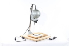 Adjutar magnification device