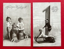2 x Glückwunsch AK NEUJAHR 1917 Kinder mit Geldsack und Schlitten  ( 122914